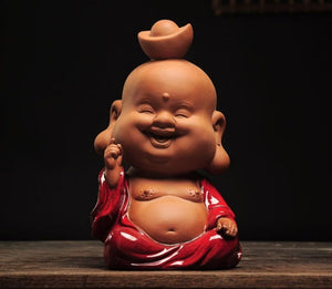 Happy buddha with ingot over head